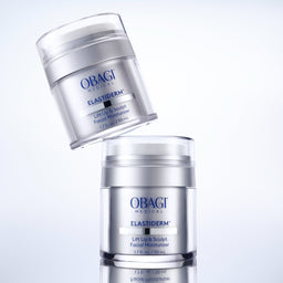 Two jars of Obagi Elastiderm facial moisturizer on a light gray background