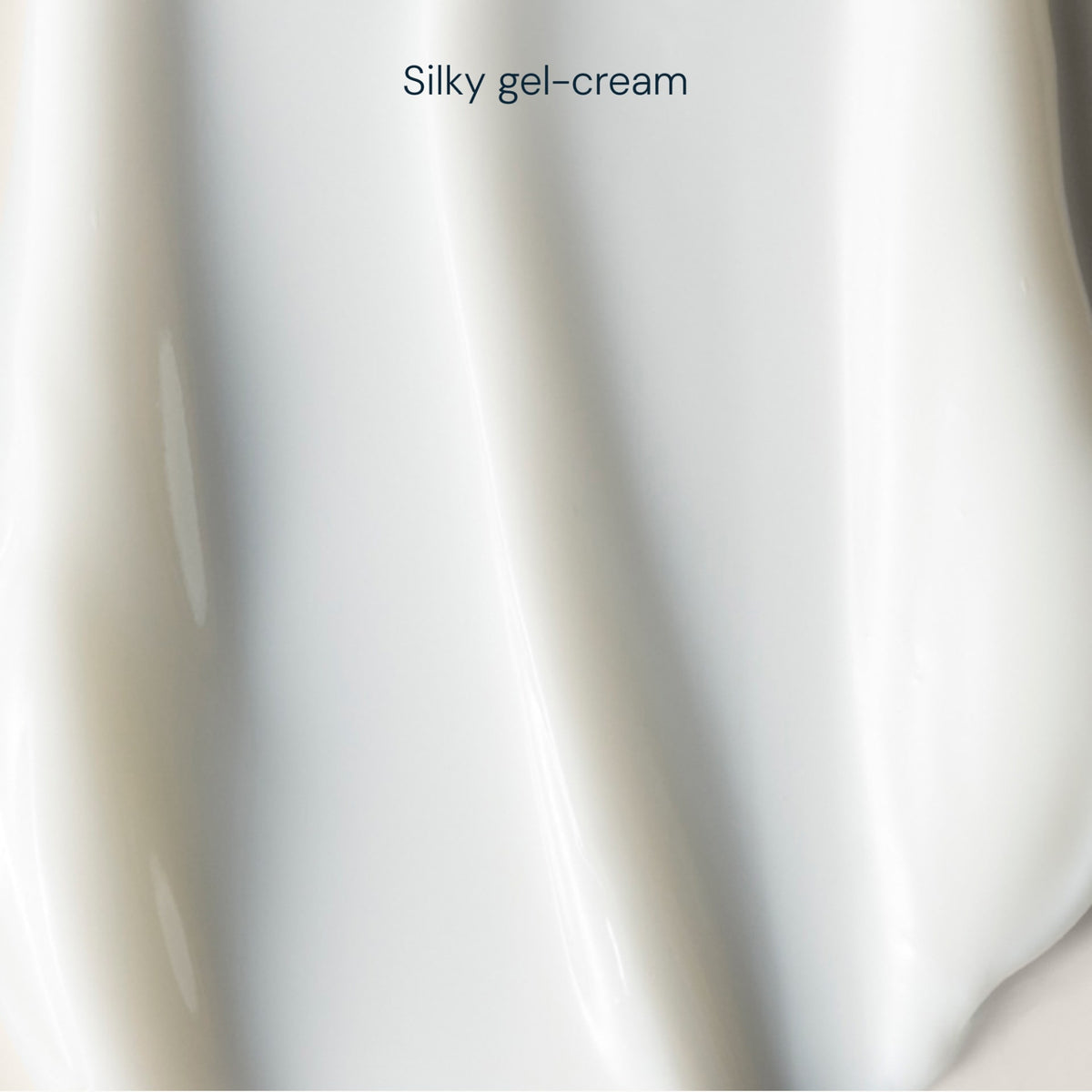 A close-up texture shot of a creamy, glossy white gel-cream with the text 'Silky gel-cream' written at the top.