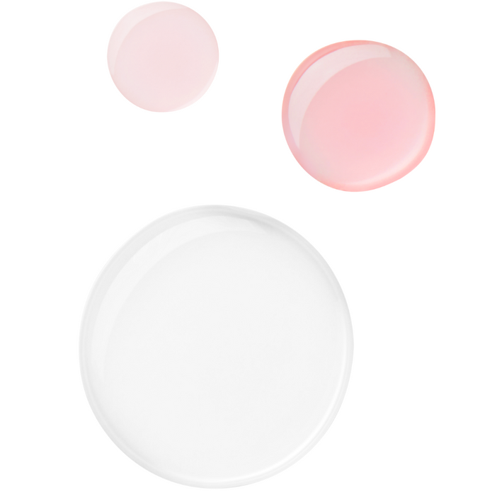 Set of three round objects with two pink and one white on a white background