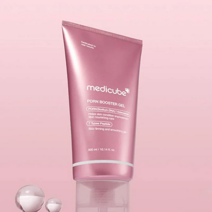 Pink tube of Medicube product on a pink background