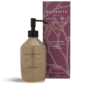 Hand lotion bottle with pump and packaging featuring 'Wildsmith' branding on a white background.