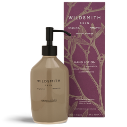 Hand lotion bottle with pump and packaging featuring 'Wildsmith' branding on a white background.