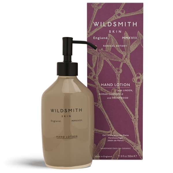 Hand lotion bottle with pump and packaging featuring 'Wildsmith' branding on a white background.