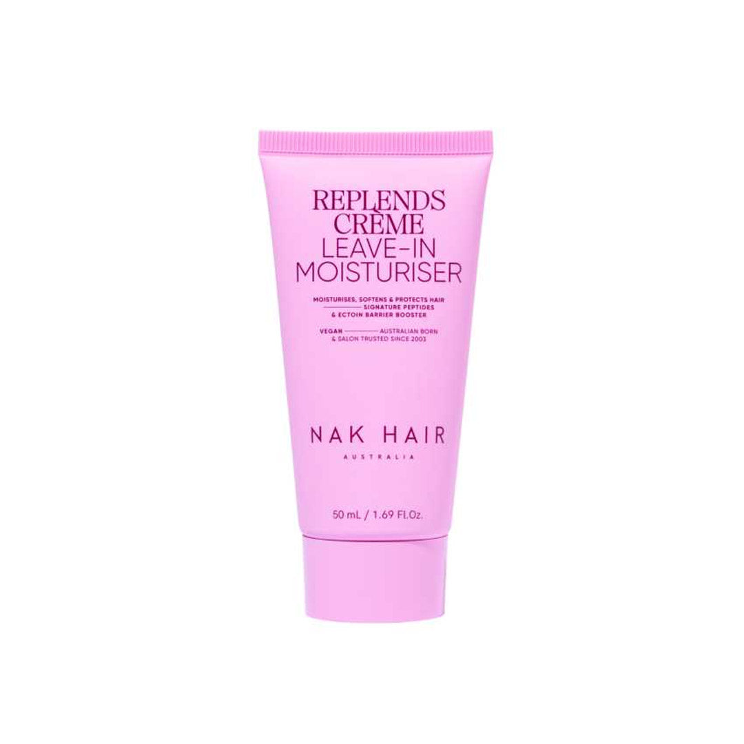Pink tube of NAK Hair Replends Creme Leave-In Moisturiser on a white background