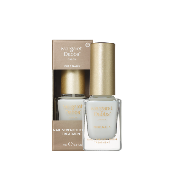 A bottle of Margaret Dabbs London Pure Nails nail strengthening treatment with a metallic gold cap, shown next to its matching gold and white cardboard packaging box on a plain white background.