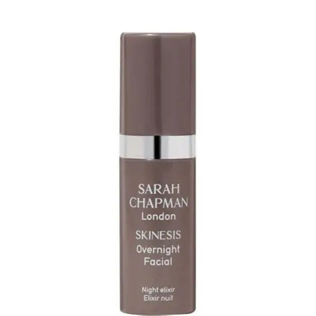 Sarah Chapman London Skinesis Overnight Facial Night Elixir in a brown bottle with a silver metallic band and white text, set against a plain white background.