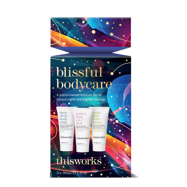 Thisworks Blissful Bodycare 3-piece gift set in a decorative box with colorful abstract artwork and three body care tubes pictured on the front.