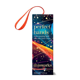 A 30ml travel-size bottle of thisworks 'perfect hands' hand care product with a vibrant multicolor label and an orange carrying loop, shown on a white background.