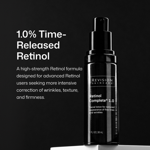 A black pump bottle of Revision Skincare Retinol Complete 1.0 facial lotion stands on a white surface against a black background, with white text on the left describing the product's 1.