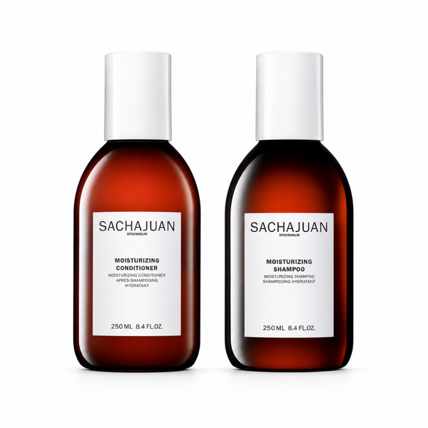 Two bottles of Sachajuan shampoo and conditioner on a white background