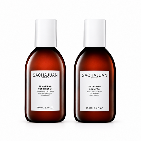 Two Sachajuan Premium thickening conditioners and shampoo bottles in amber brown with white caps and white labels, shown side by side on a white background.