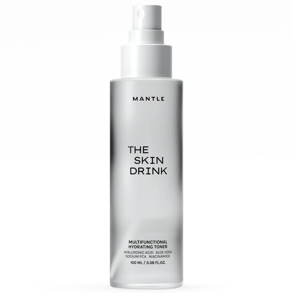 A 100 ml bottle of MANTLE The Skin Drink Multifunctional Hydrating Toner, featuring a frosted glass bottle and a white spray pump dispenser, shown against a plain white background.
