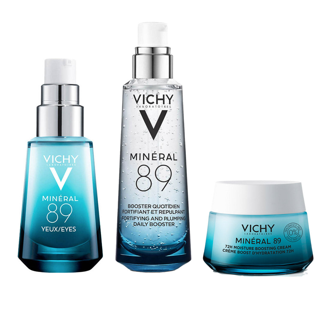 Three Vichy Mineral 89 skincare products on a white background: a blue pump bottle, a clear bottle with silver pump, and a blue-and-white jar.