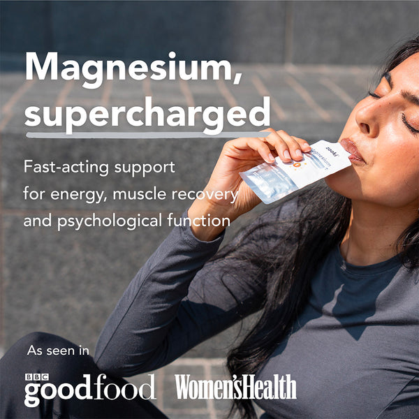 Woman holding a supplement package with text about magnesium benefits and media references.