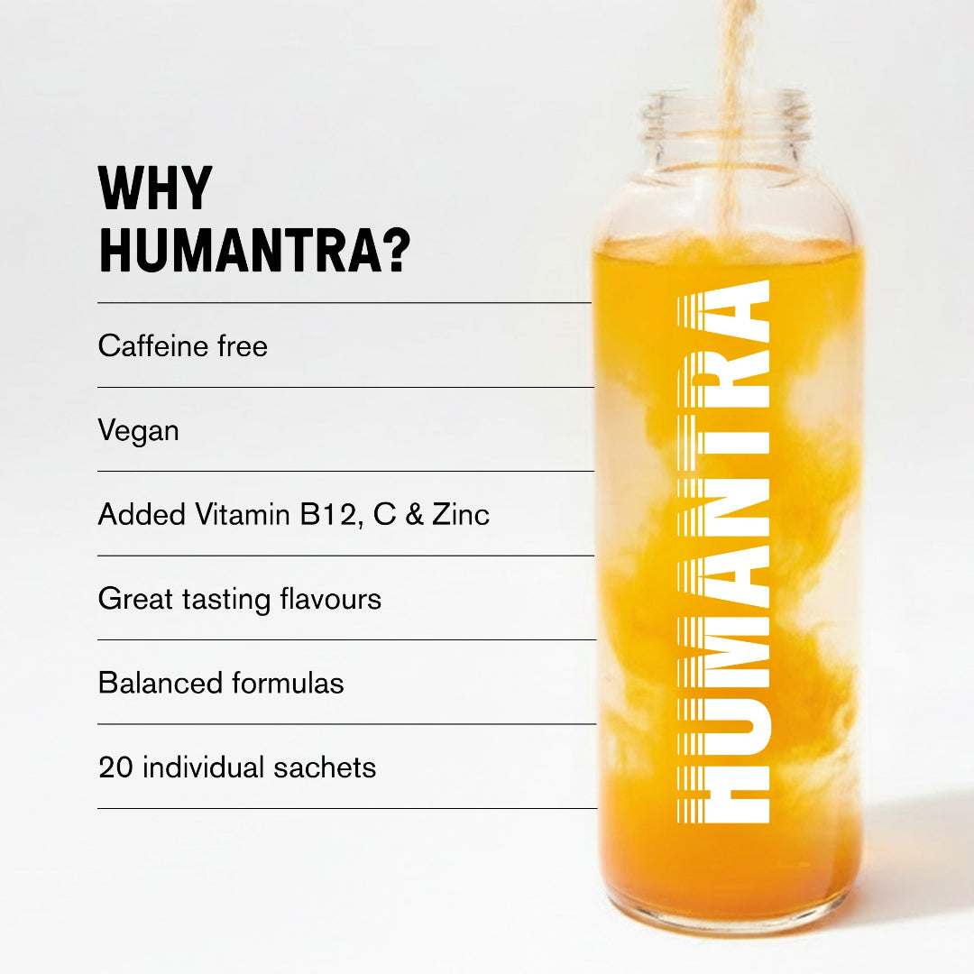 A clear glass bottle filled with orange-yellow liquid and ice, with the brand name HUMANTRA printed vertically in white. To the left is a white text panel reading 'WHY HUMANTRA?' with bullet points about caffeine-free, vegan, vitamin B12, and other benefits.