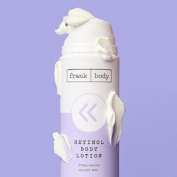 Retinol body lotion bottle with 'frank body' branding on a purple background