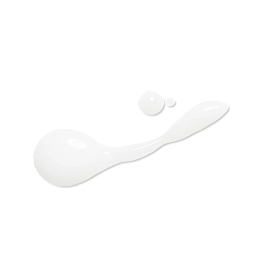 A glossy white cosmetic smear or droplet shape on a plain white background.